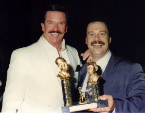 TV host John Burgess congratulates Greg Doolan at the Wallace Awards 1994.